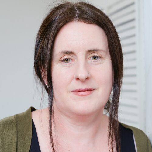 Headshot of author JM O'Brien against a white background.